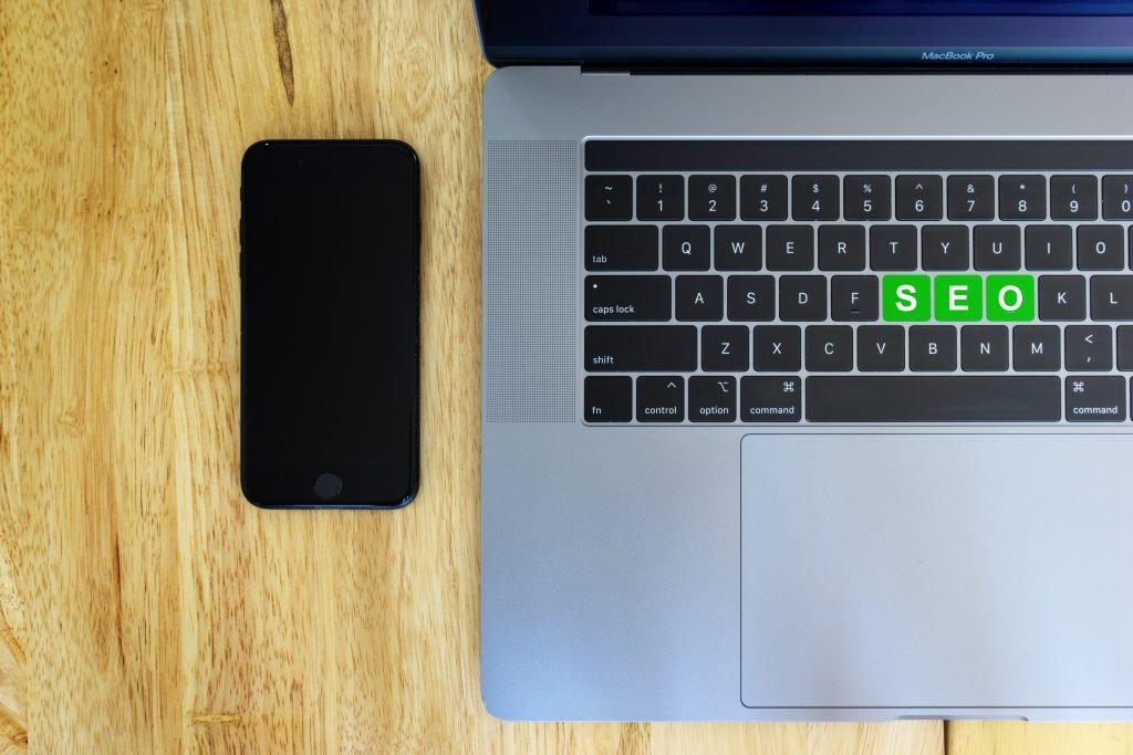 Image of laptop and phone on desk
